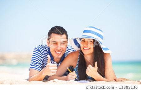 Young students in love on the beach. 13885136