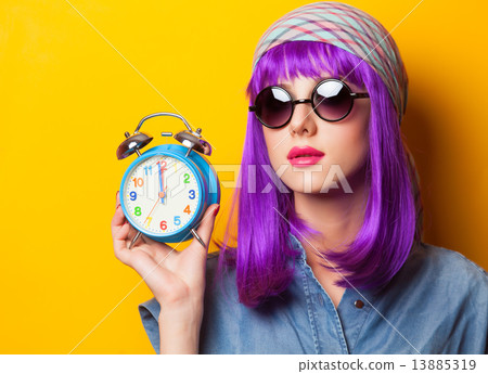 Beautiful girl with violet hair in sunglasses and alarm clock on 13885319