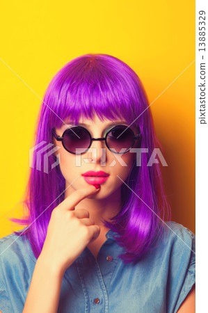 Beautiful girl with violet hair in sunglasses on yellow backgrou Beautiful girl with violet hair in sunglasses on yellow backgrou 13885329