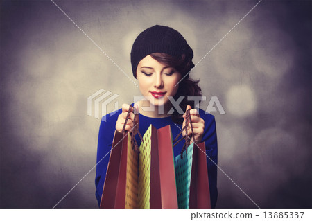women in blue dress with shopping bags women in blue dress with shopping bags 13885337