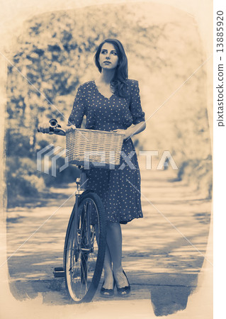 Beautiful girl with bike at countryside. Vintage. Beautiful girl with bike at countryside. Vintage. 13885920