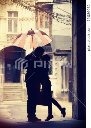 Couple kissing at patio 13886081