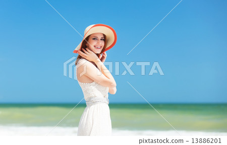 Redhead girl on the beach in spring time. 13886201