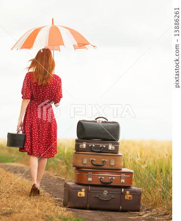 Redhead girl with suitcases at outdoor 13886261