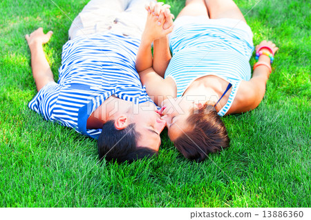 Young teen couple kissing at outdoor Young teen couple kissing at outdoor 13886360