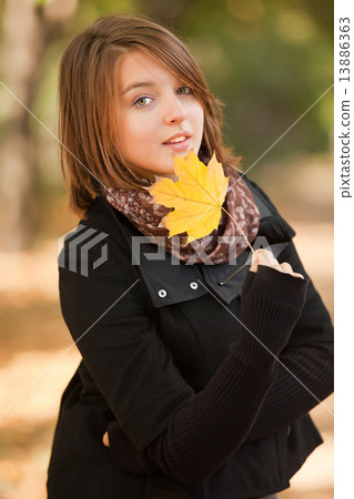 Beautiful girl at autumn park. Beautiful girl at autumn park. 13886363
