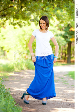 Beautiful teen girl in the park at green grass. 13886402
