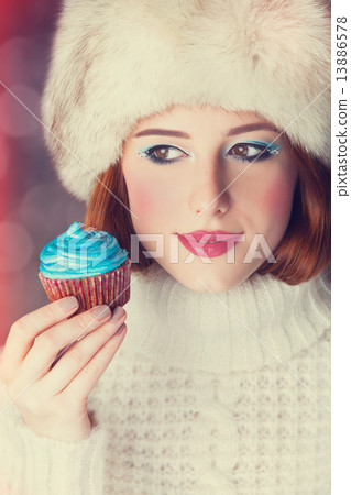 Redhead girl with cake. Redhead girl with cake. 13886578