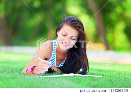 beautiful young brunette woman with note at outdoor beautiful young brunette woman with note at outdoor 13886869