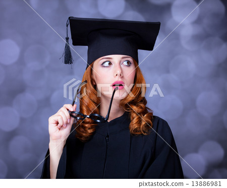 graduating student girl in an academic gown. graduating student girl in an academic gown. 13886981
