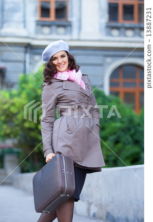 Women with suitcase at outdoor. Women with suitcase at outdoor. 13887231