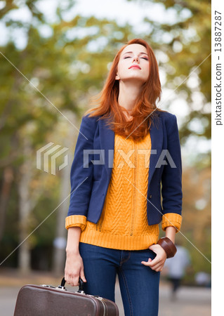 Girl with suitcase at autumn outdoor Girl with suitcase at autumn outdoor 13887287