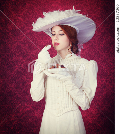 Beautiful redhead women with candy. Beautiful redhead women with candy. 13887360