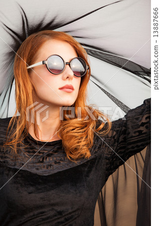 Redhead girl in sunglasses at outdoor 13887666