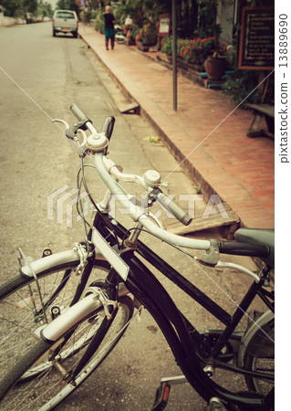Vintage Bicycle Travel Resting in the city Street on Luang praba 13889690