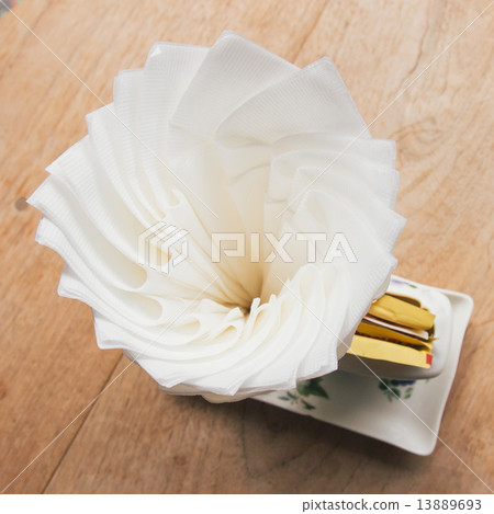 Tissue paper on wood table in coffee shop Tissue paper on wood table in coffee shop 13889693