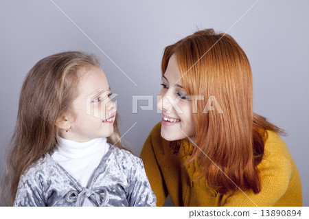 Two sisters looking at at each other Two sisters looking at at each other 13890894