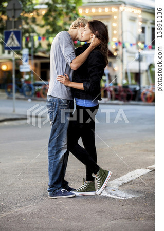 Young couple kissing on the street 13891136