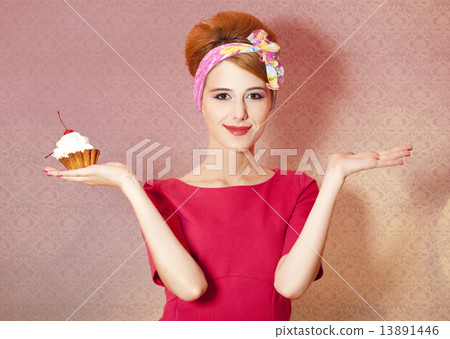 Style redhead girl with cake at pink background. 13891446