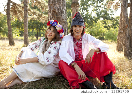 Slav girl with wreath and young cossack at nature Slav girl with wreath and young cossack at nature 13891799
