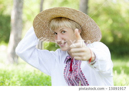 Young slav teen at green meadow in national clothing. Young slav teen at green meadow in national clothing. 13891917