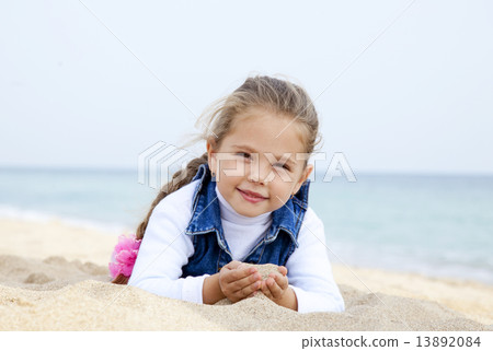Portrait of cute young girl on the beach Portrait of cute young girl on the beach 13892084