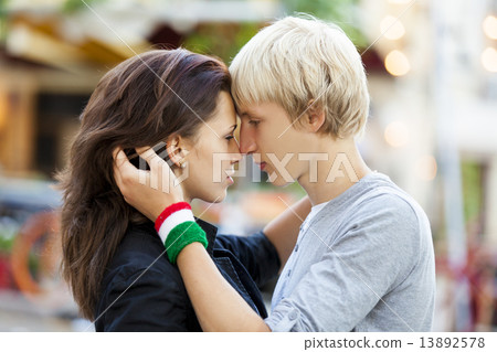 Young couple kissing on the street 13892578