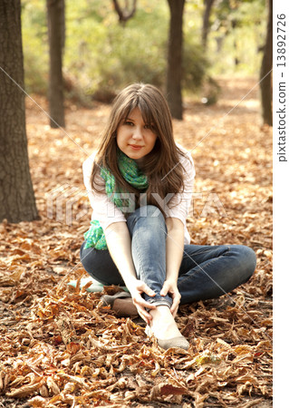 Portrait brunette girl at outdoor. Autumn. 13892726