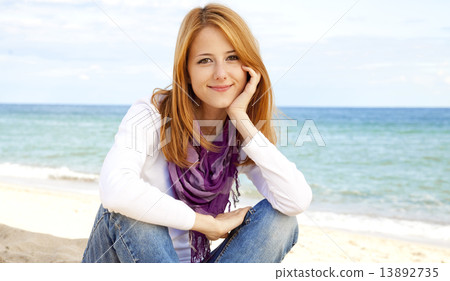 Young beautiful girl at the beach 13892735