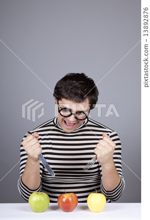 Funny boy try to eat apples. Funny boy try to eat apples. 13892876