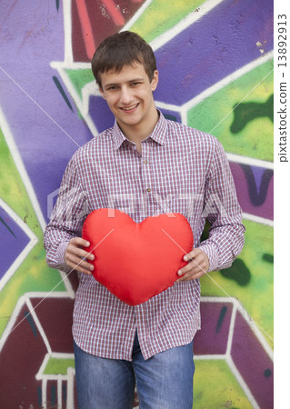 Romantic teen near graffiti wall. 13892913