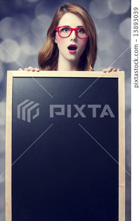 Redhead student with blackboard. Redhead student with blackboard. 13893039