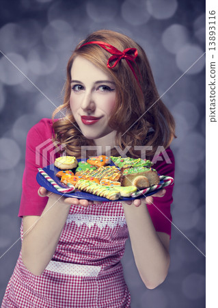 Redhead women with cookies Redhead women with cookies 13893116