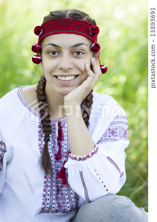 Slav girl at green meadow. 13893691