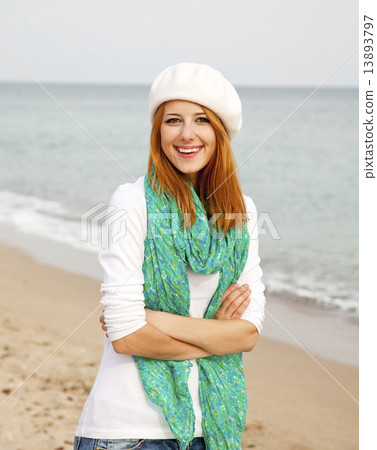 Young beautiful girl at the beach. Young beautiful girl at the beach. 13893797