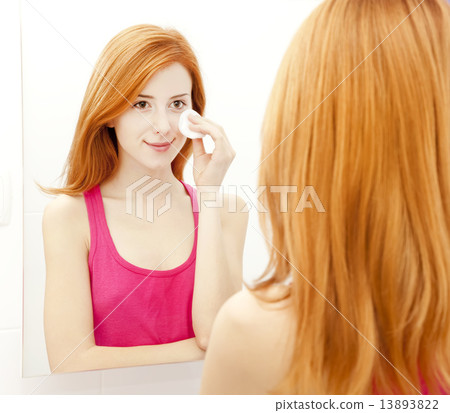 Beautiful redhead young woman with fresh skin of face in bathroo 13893822