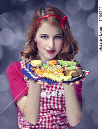 Redhead women with cookies Redhead women with cookies 13893914