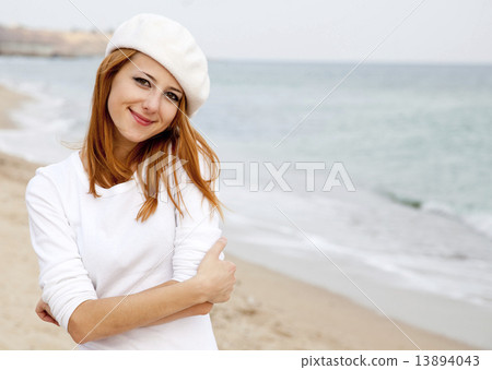 Young beautiful girl walking at the beach 13894043