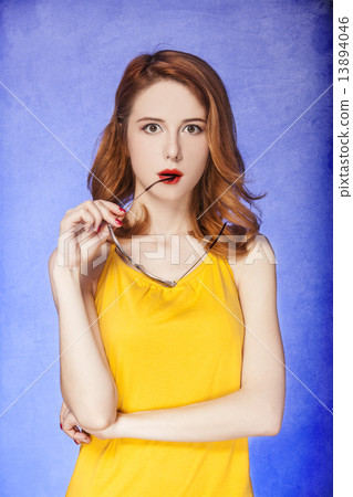 American redhead girl in sunglasses. Photo in 60s style. 13894046