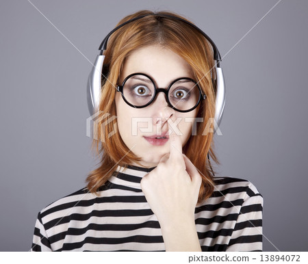 Funny girl with headphone and glasses. 13894072
