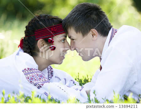 Slav girl and young cossack at nature. 13894211