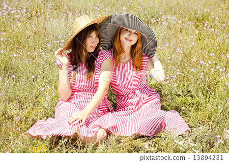 Two girls at contryside. 13894281
