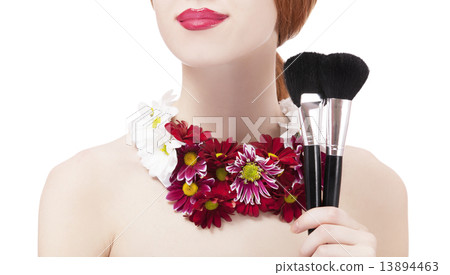 Beautiful redhead girl with flowers and makeup brush 13894463
