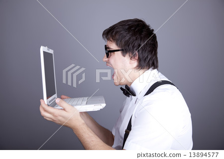 Men in suspender with bow tie and glasses keeping notebook. Men in suspender with bow tie and glasses keeping notebook. 13894577