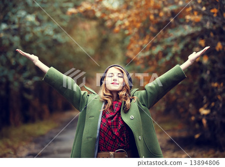 Style redhead girl at beautiful autumn alley. 13894806