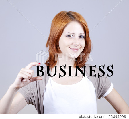 Red-haired businesswoman show abstract word "businiess'. 13894998