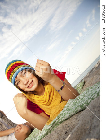 Portrait of beautiful brunet girl in cap 13895013