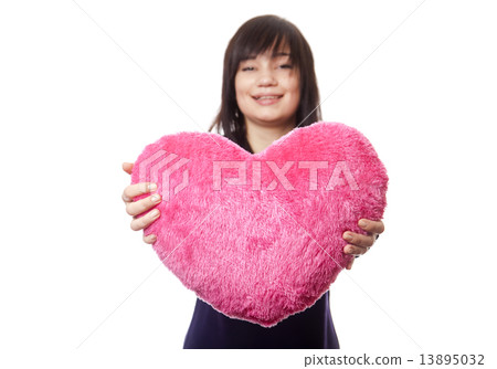 Beautiful brunette girl with toy heart. Beautiful brunette girl with toy heart. 13895032