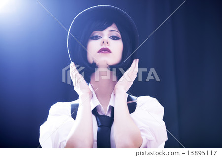 Fashion brunette girl in hat. Studio shot with backlight. 13895117