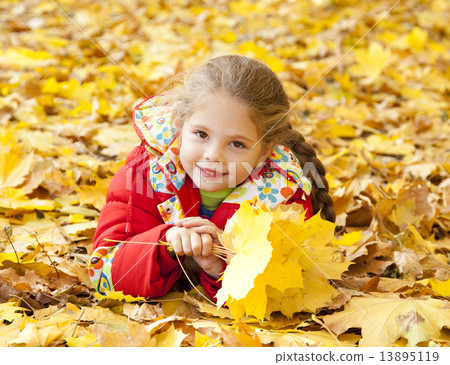 Child in autumn park. Child in autumn park. 13895119